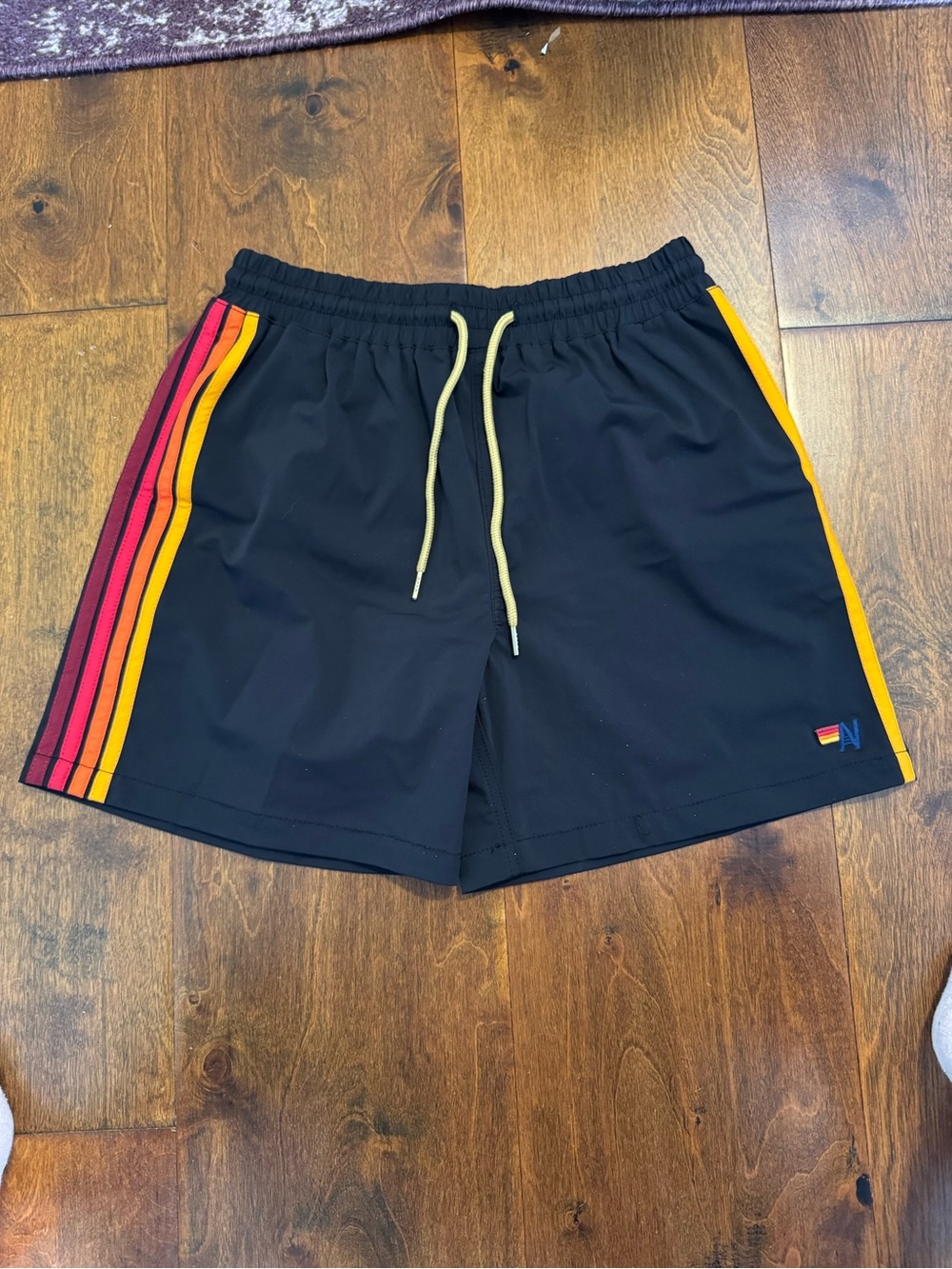 Aviator Nation Black Nylon Shorts with Yellow and Red Stripe Accents